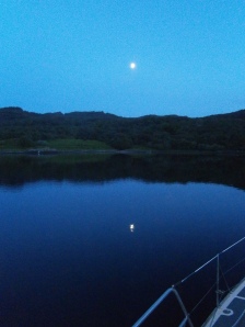 Half moon at neap tides reflected in the still water at our anchorage in the Kyles of Bute
