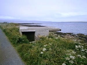 Scapa Flow was an important naval base in both World Wars so there are inevitably remnants of defenses, such as this search light station overlooking the Sound of Hoy entrance to Scapa Flow. A rapid fire gun emplacement, control tower, generator house and encampment completed this group of buildings.