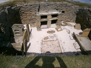 Later period house from about 3500 years ago. Stone beds each side, fireplace in the centre and stone dresser on the far side.
