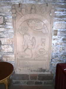 Graphic 17th century tombstones adorn the side walls of the Cathederal