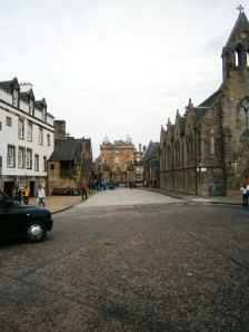 The end of the Royal Mile and part of Holyrood Palace at the end. 