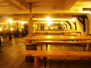 The Lower Deckk where the crew lived in cramped conditions. Part of the Navy discipline included daily cleaning of the ship, a factor that helped enable the British to keep their ships at sea over long periods, even though the quality of the food left much to be desired due to the limited means of preservation then available.