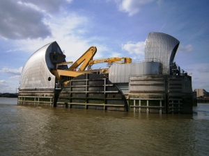 The Thames Barrier works by pivoting huge gates that normally rest on the river bed. This photo shows the end of once of these gates and the mechanism for moving it. The barrier is tested once a month during low tide and had been used to prevent real possibilities of flooding 119 times by 2010. It was also used to ensure there was plenty of water in the Thames with little flow for the Water Pagent to celebrate the Queen's Diamond Jubilee last year and to assist in the rescue after the Marchioness disaster.