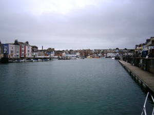 Weymouth is an attractive old own round its old harbour. There is the seaside bit to the east with the sandy beach and donkey rides in the season.